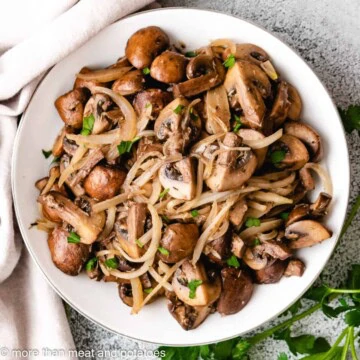 Overhead view of sauteed mushrooms and onions.