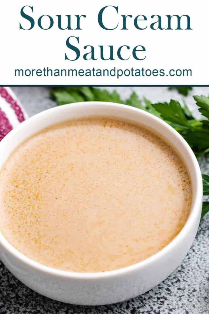 Close up view of a bowl of sour cream steak sauce.