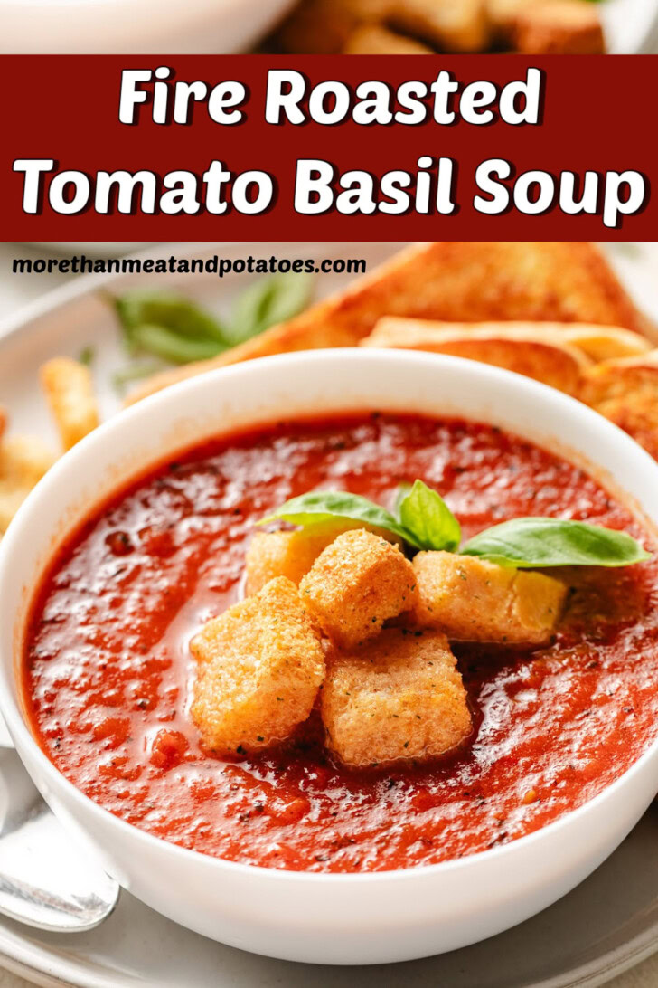 Bowl of tomato basil soup topped with basil.