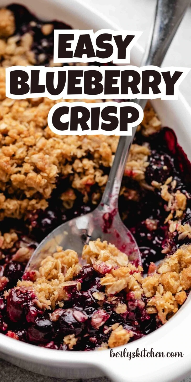 Close up view of a pan of blueberry crisp.