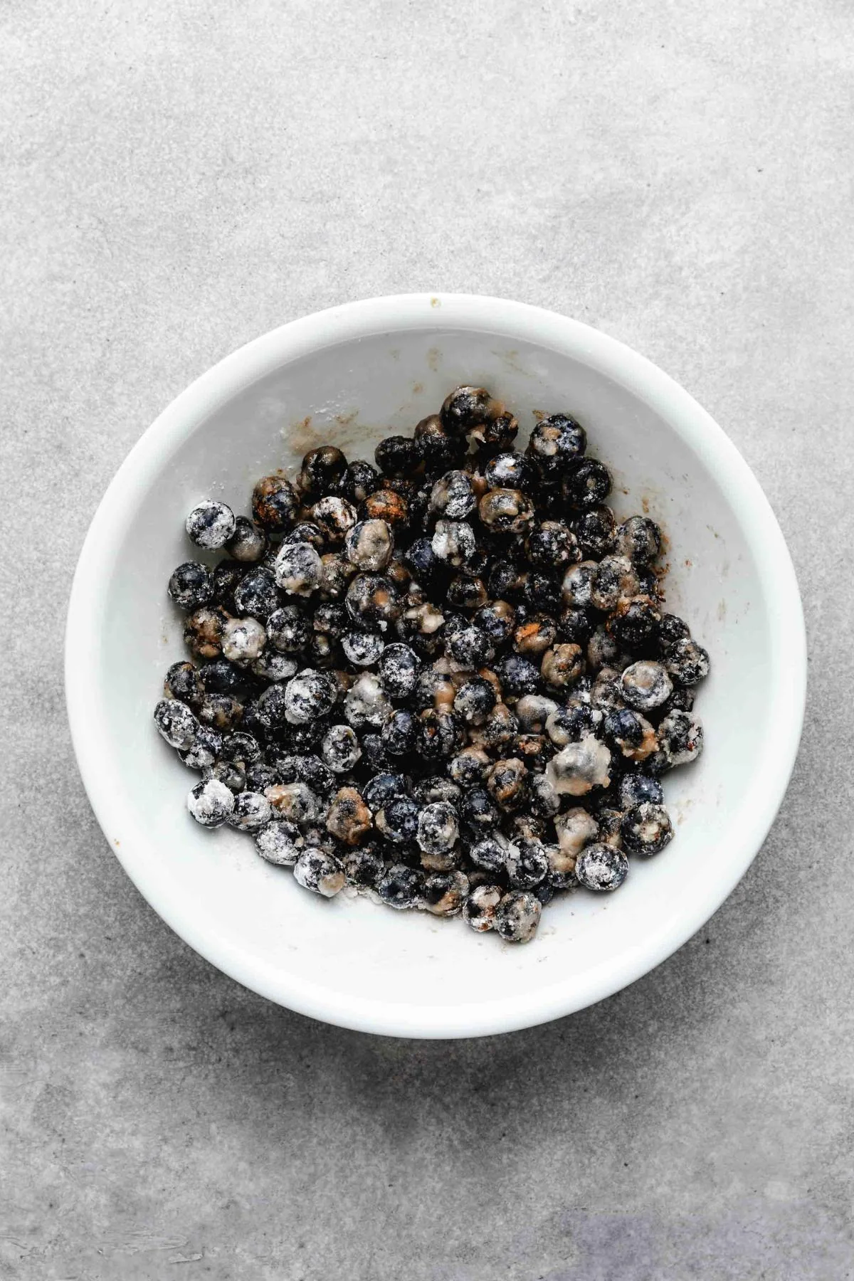 Blueberry filling mixed in a white bowl.