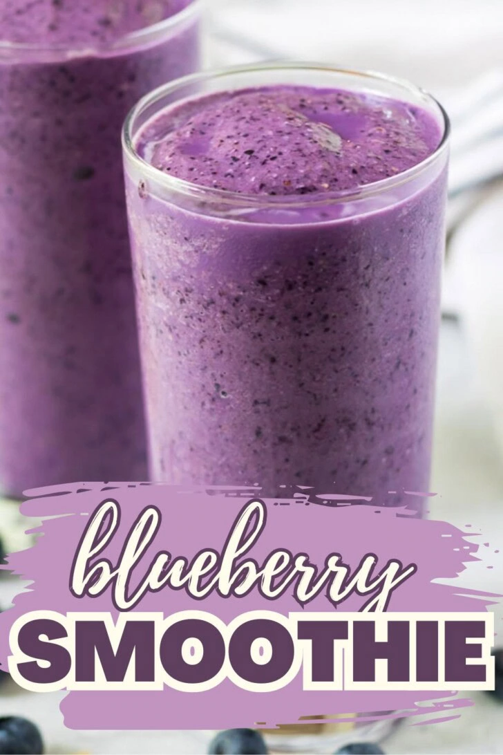 Easy blueberry smoothie filling a clear glass.