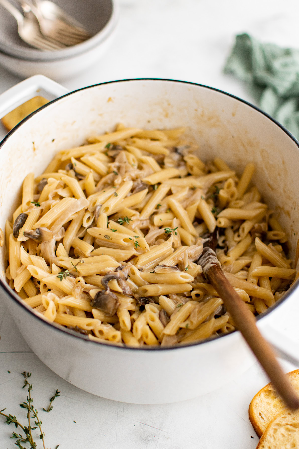 Creamy French onion pasta in a large cooking pot.