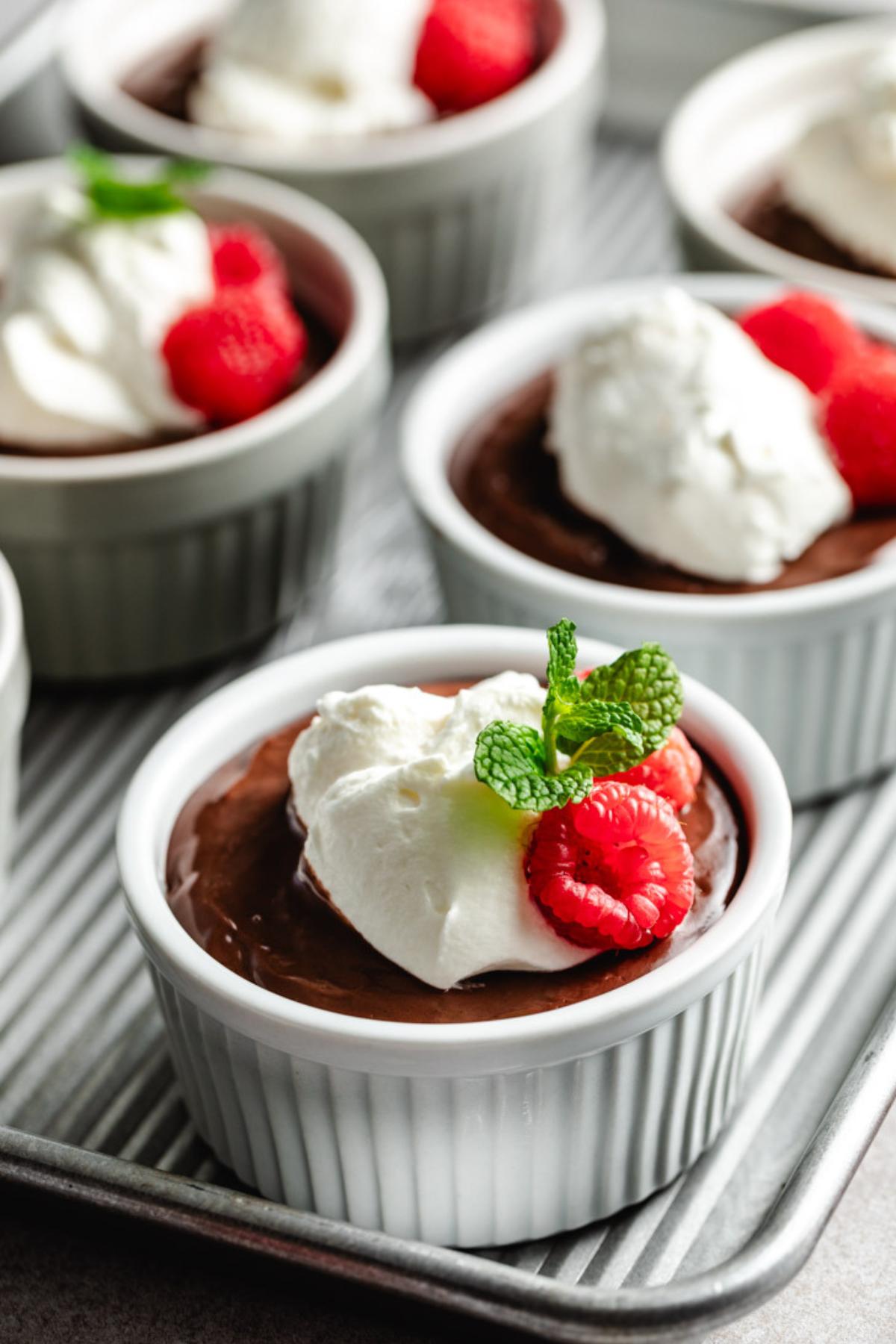 Mint and raspberries on top of homemade chocolate pudding.