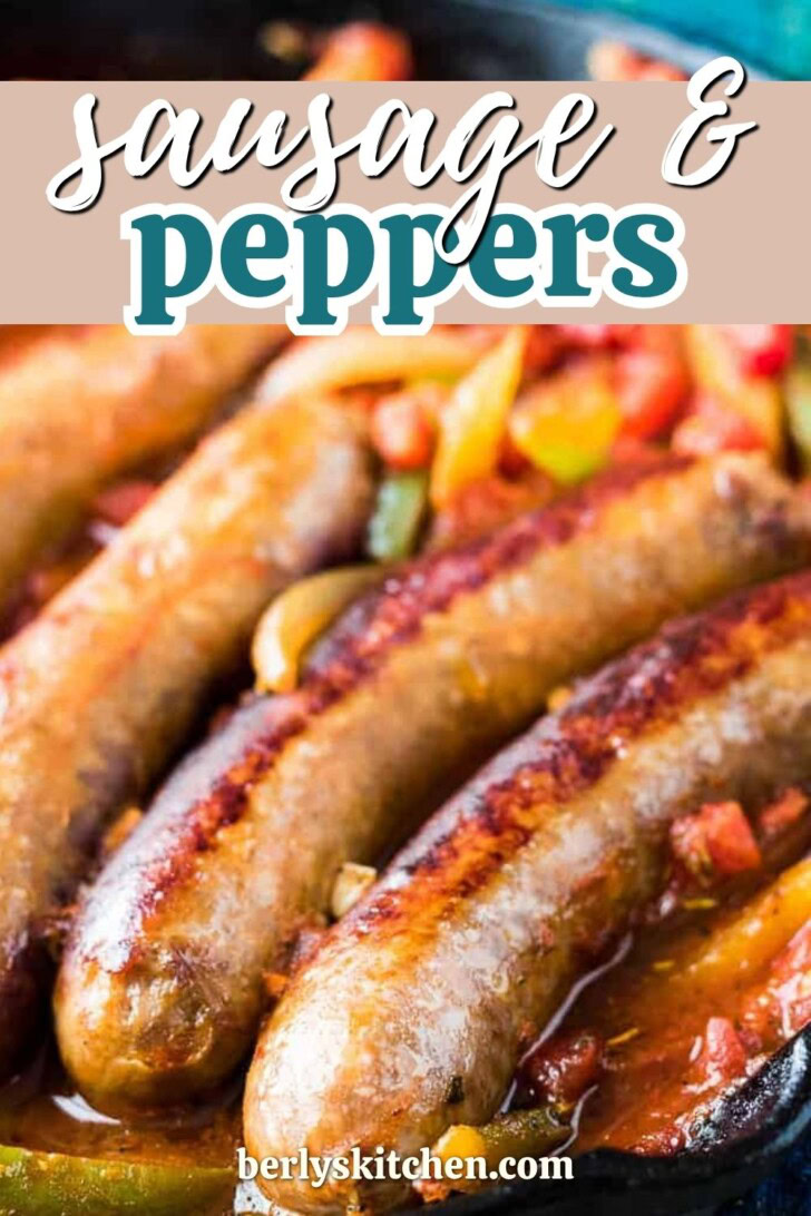 Sausage links in a pan with peppers and onions.