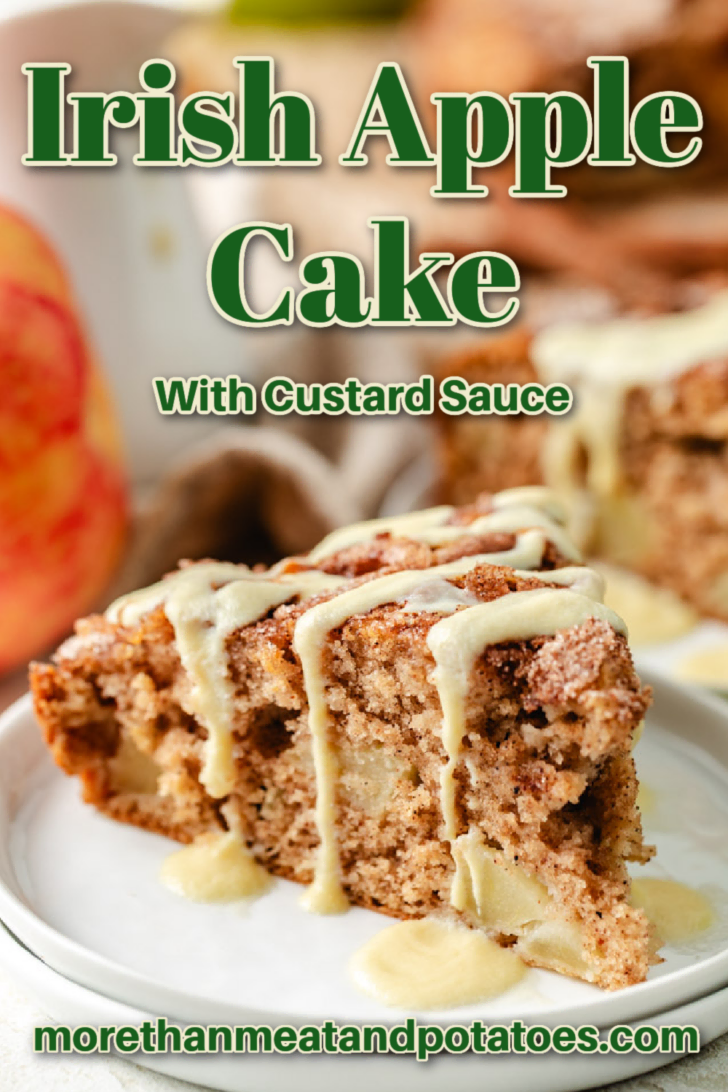 A slice of Irish apple cake drizzled with custard sauce on a white plate.